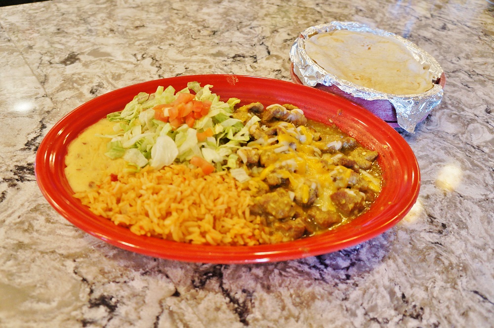 Green chile guisada plate at Albarran's