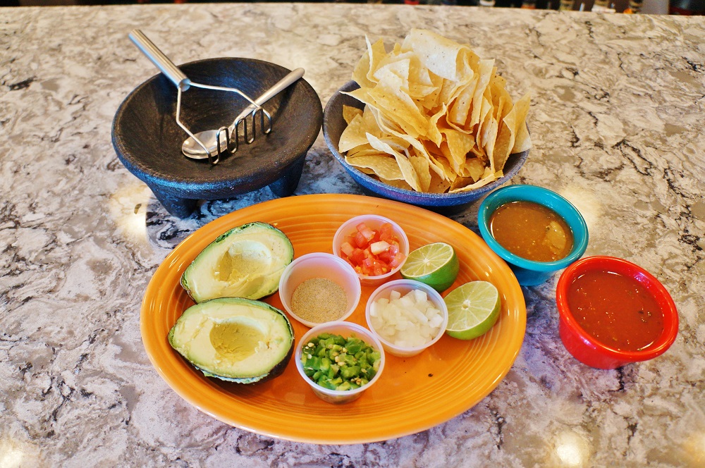 Guacamole sampler with chips and salsas